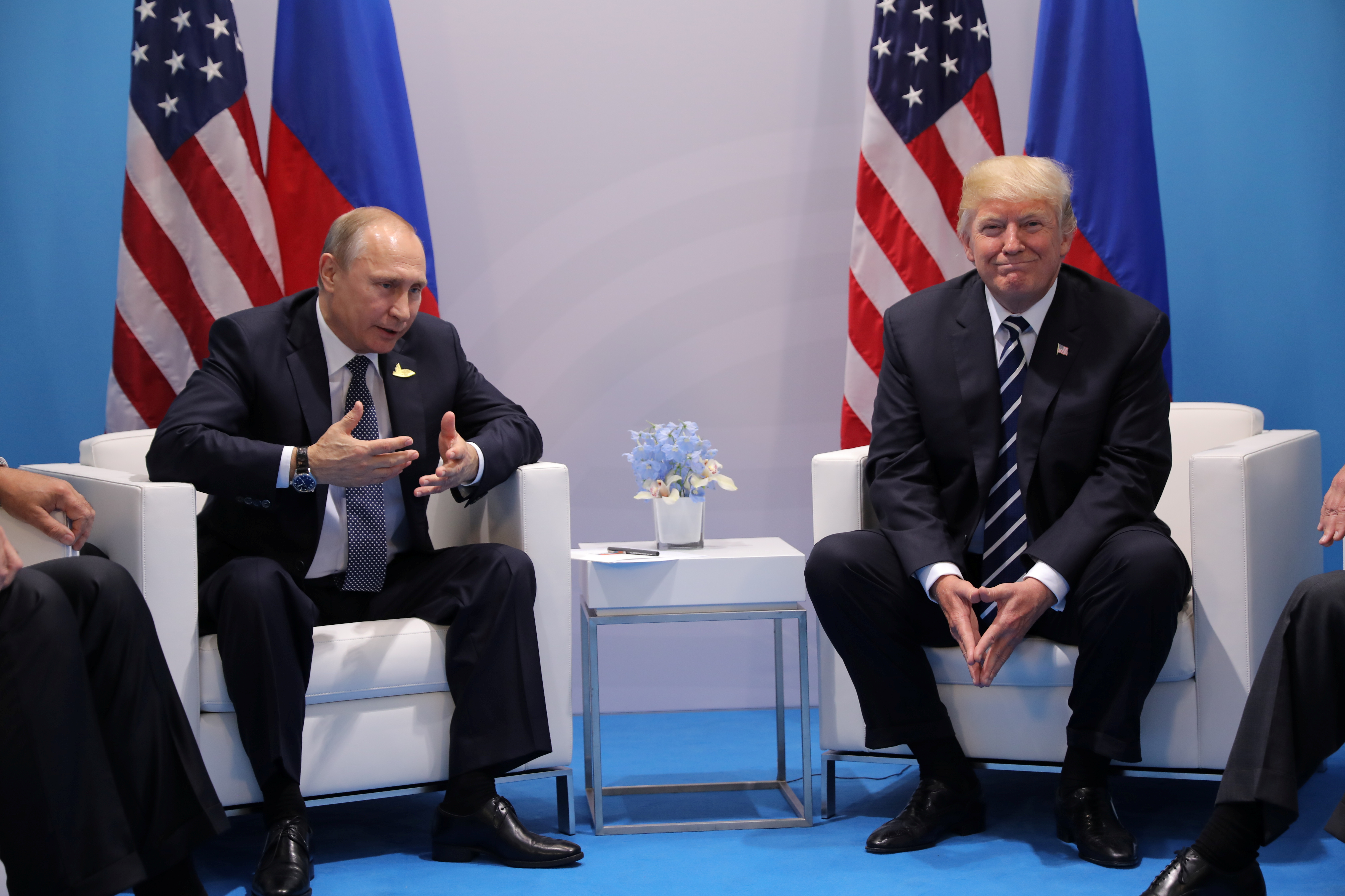 FILE PHOTO: Russia's President Vladimir Putin talks to U.S. President Donald Trump during their bilateral meeting at the G20 summit in Hamburg