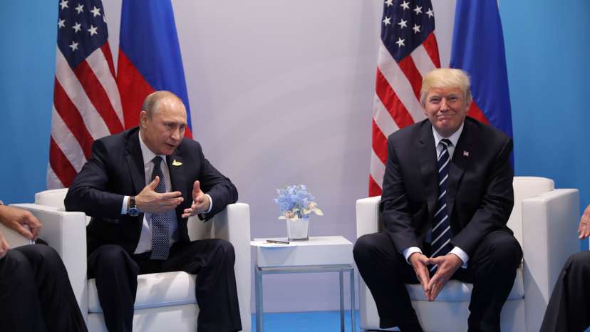 FILE PHOTO: Russia's President Vladimir Putin talks to U.S. President Donald Trump during their bilateral meeting at the G20 summit in Hamburg