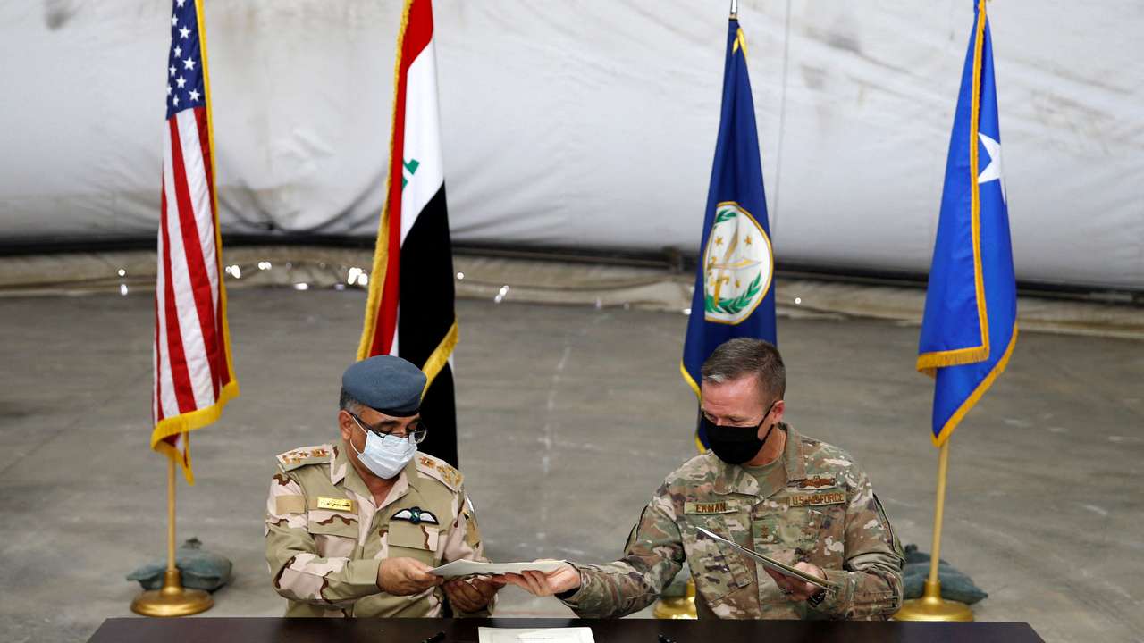FILE PHOTO: U.S.-led troops withdraw from Iraq's Taji base