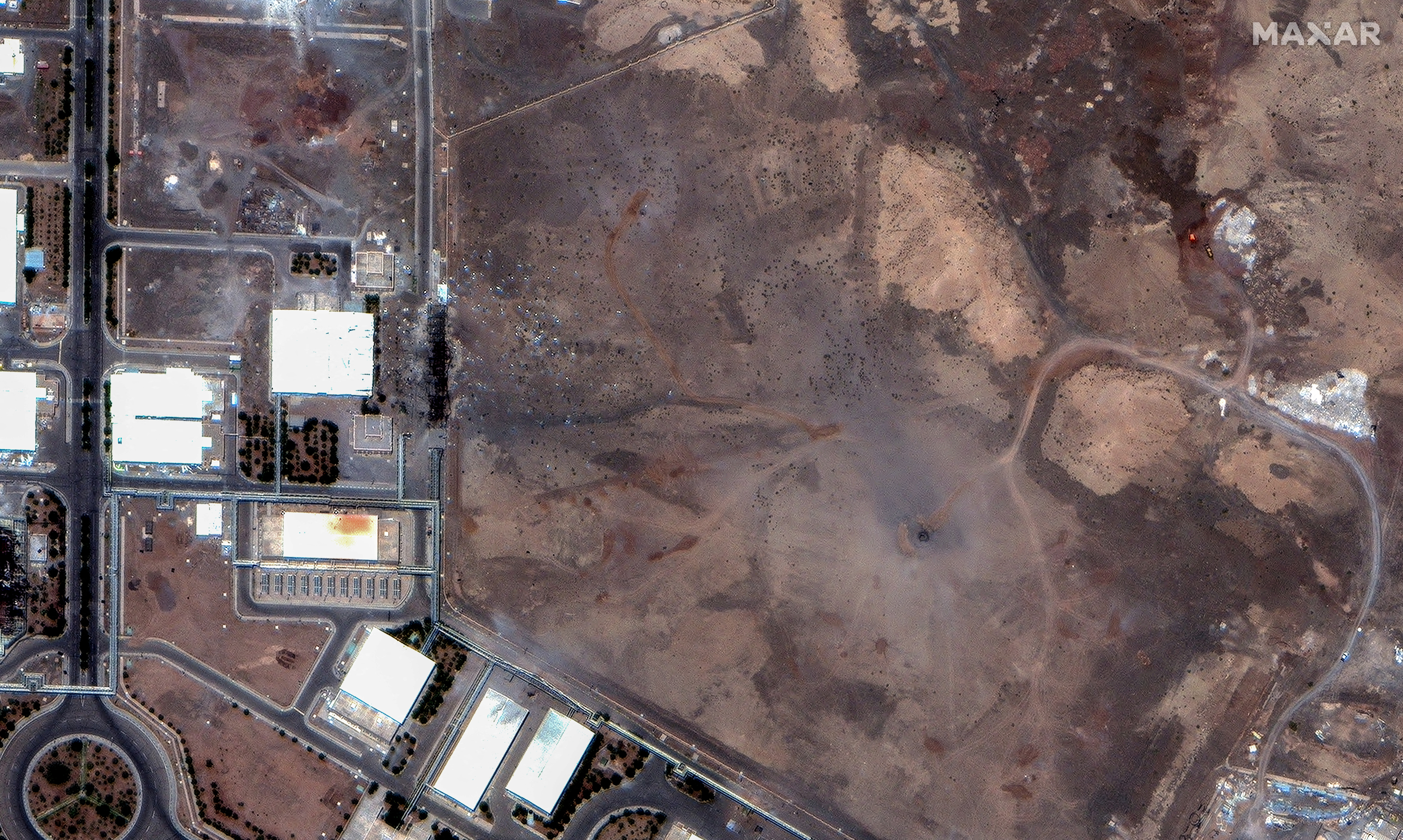 A satellite image shows airstrike craters over the underground centrifuge halls of the Natanz Enrichment Facility