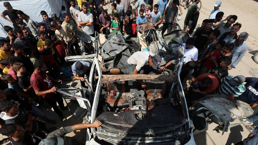 Aftermath of an Israeli strike on a vehicle in Deir Al-Balah in the central Gaza Strip