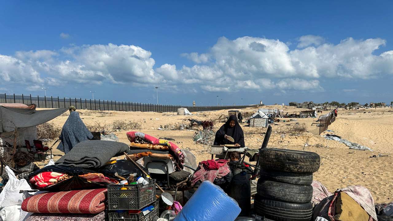 Displaced Palestinians take shelter at the border with Egypt, during an Israeli military operation, in Rafah