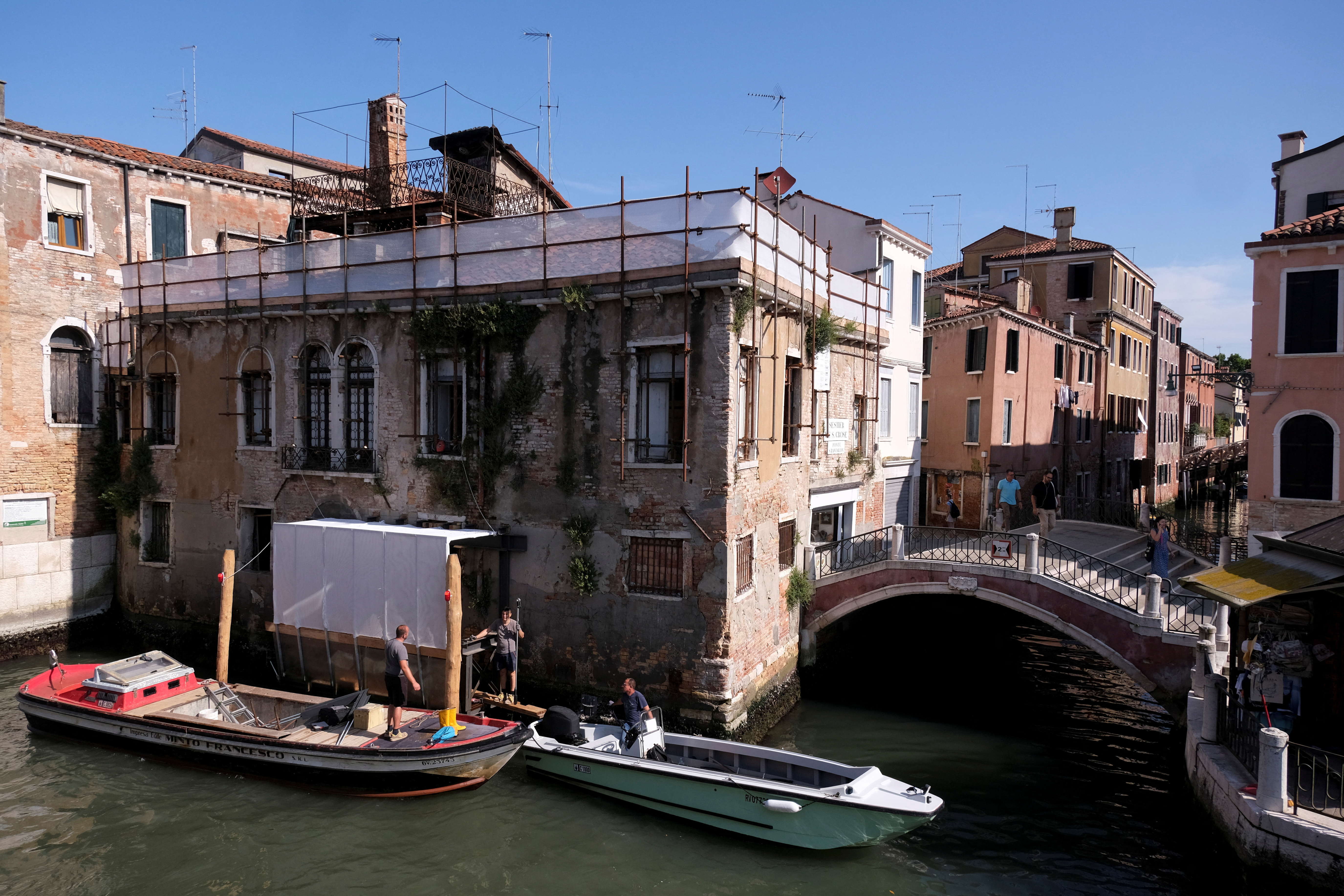 Beginning of the restoration process of Banksy's 'Migrant Child', in Venice