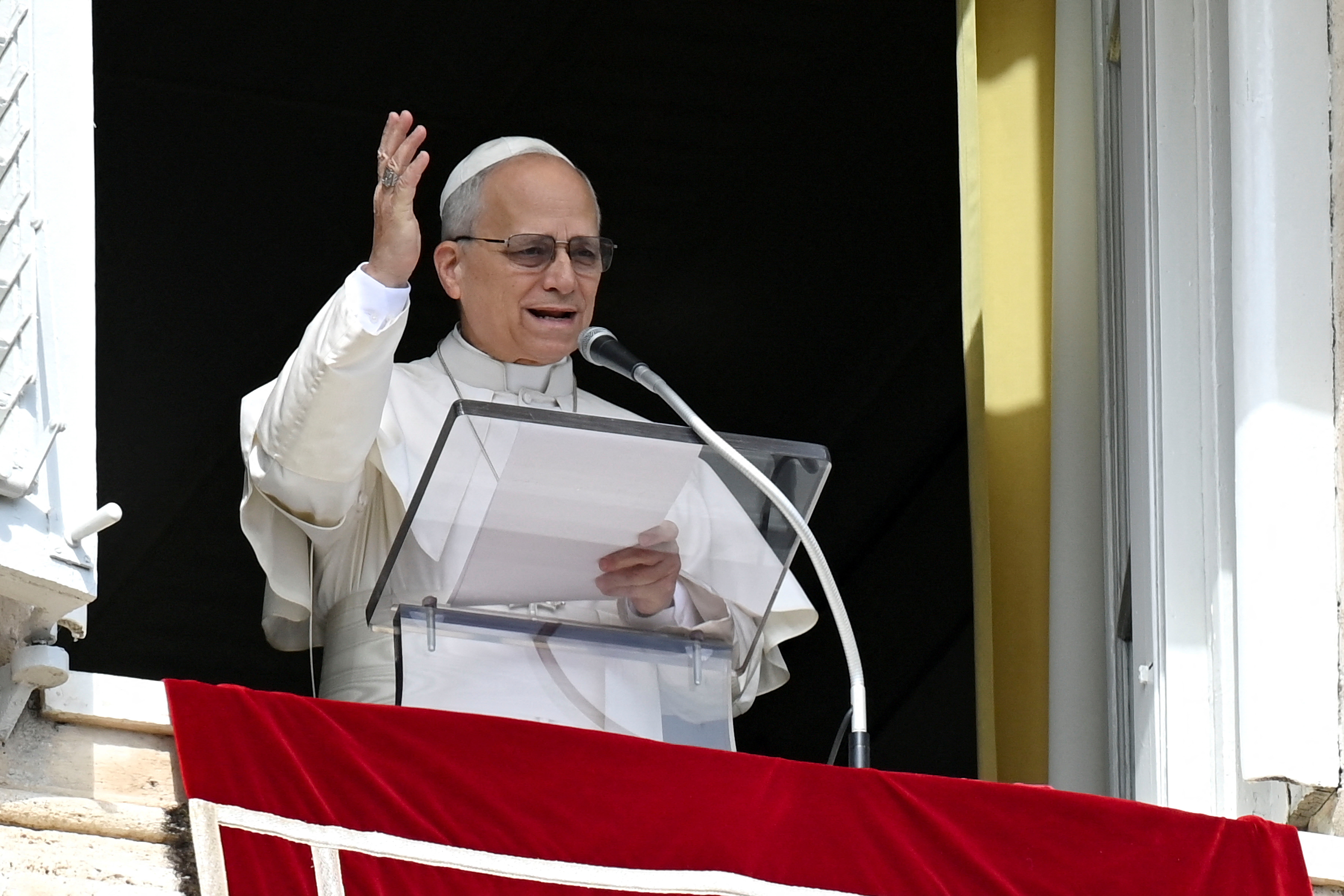 Pope Leo XIV leads the Angelus prayer from the window of the Apostolic Palace at the Vatican