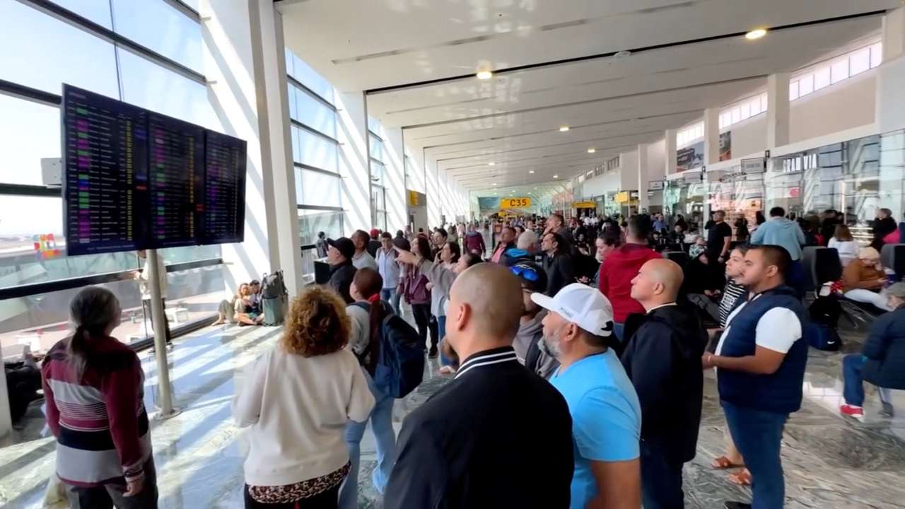 People gather at the Guadalajara International Airport, in Tlajomulco de Zuniga