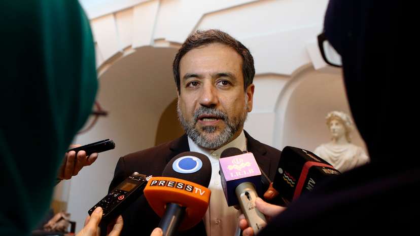 Iran's top nuclear negotiator Araqchi talks to journalists after meeting senior officials from the United States, Russia, China, Britain, Germany and France in a hotel in Vienna