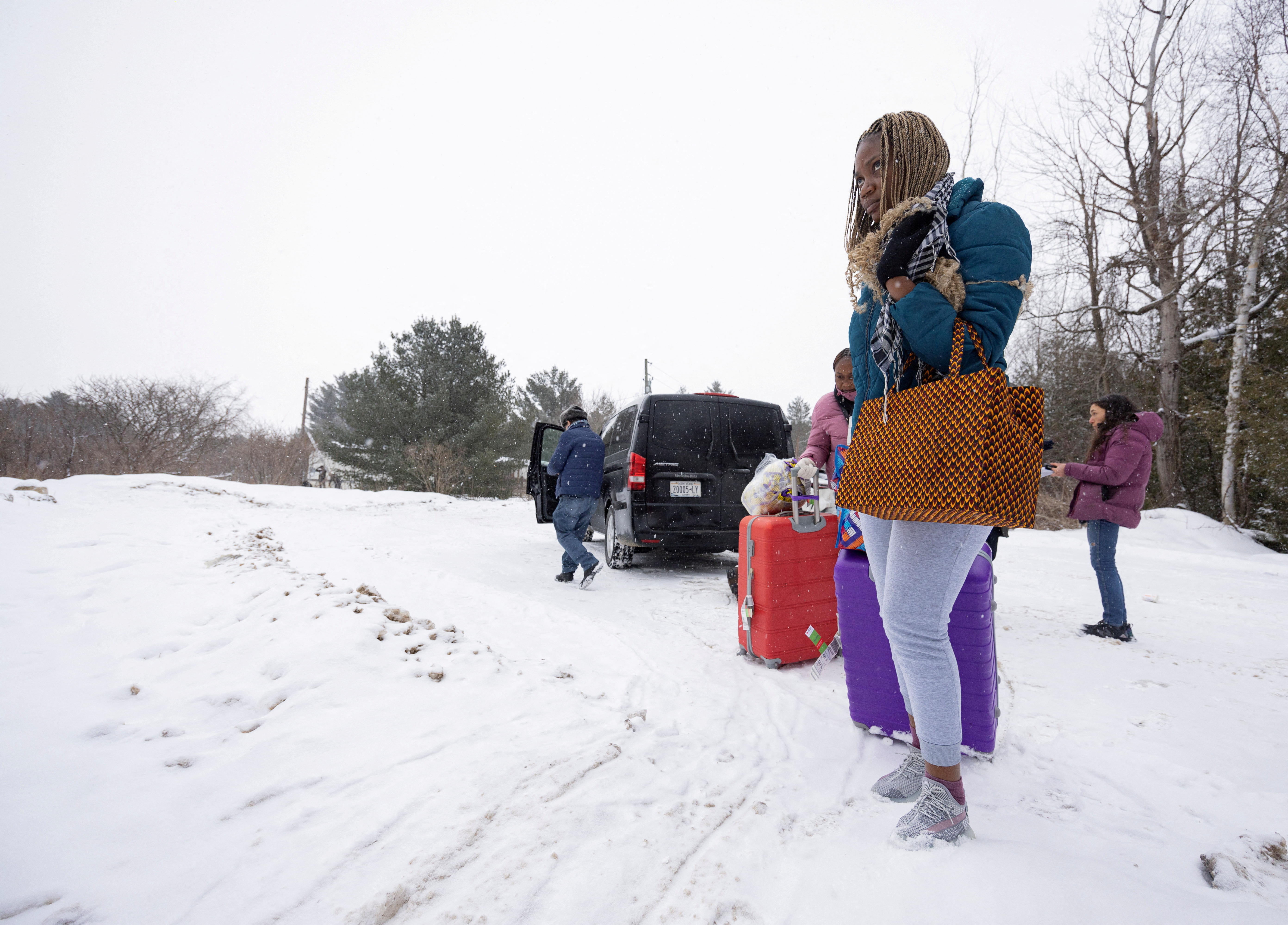 FILE PHOTO: Asylum seekers cross into Canada from Roxham Road in Champlain New York