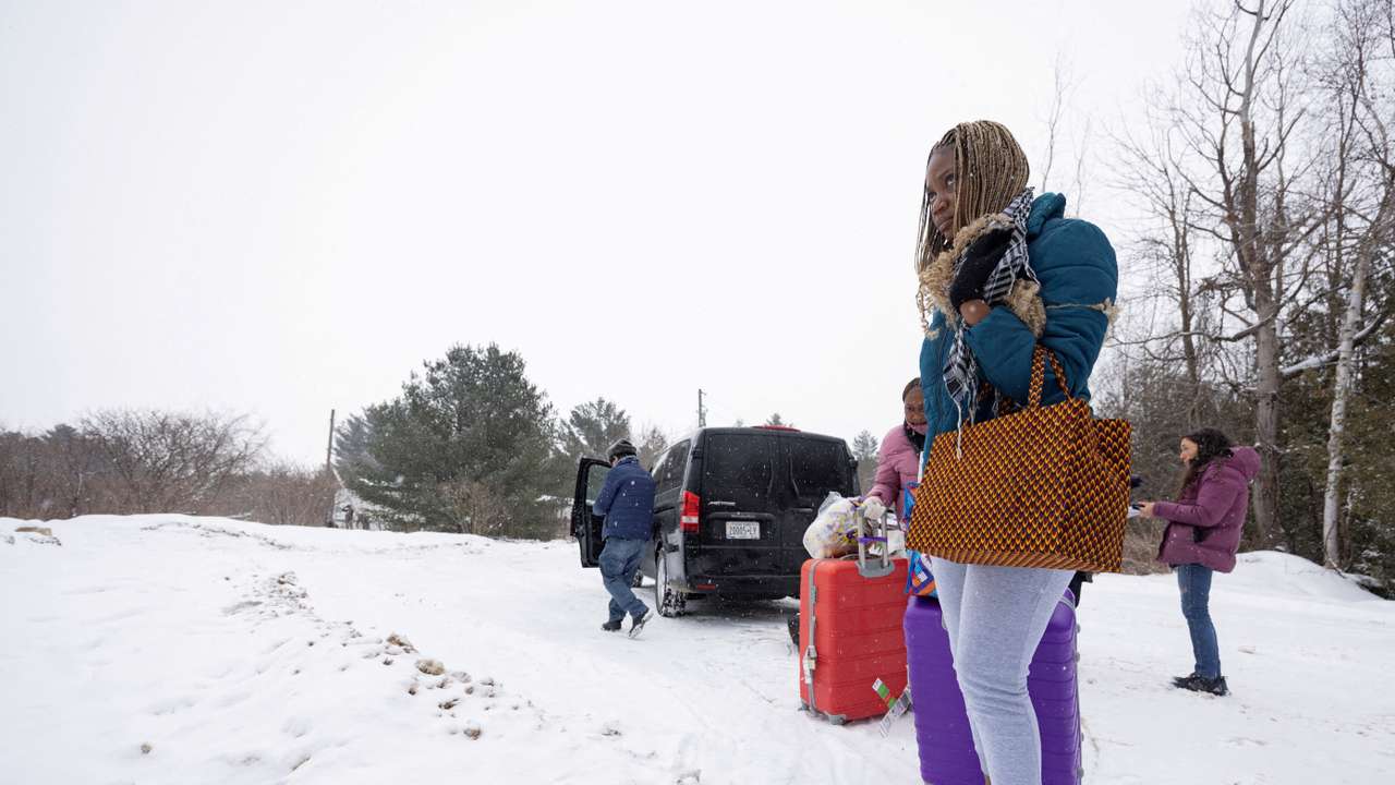 FILE PHOTO: Asylum seekers cross into Canada from Roxham Road in Champlain New York