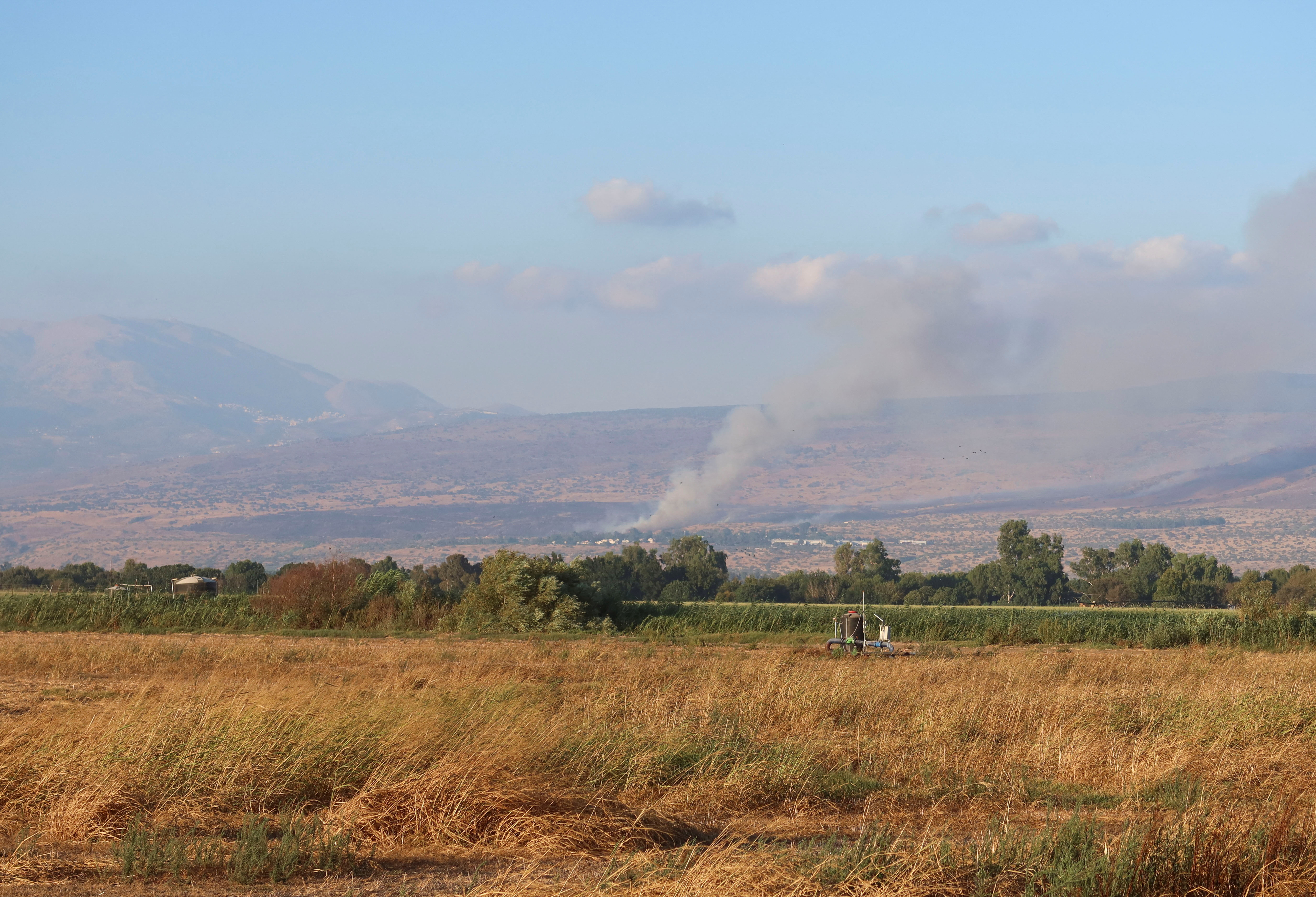 Smoke rises after rockets were fired from Lebanon, amid cross-border hostilities between Hezbollah and Israel, in the Israeli-occupied Golan Heights