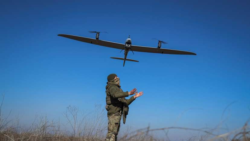 FILE PHOTO: A Ukrainian serviceman launches a mid-range reconnaissance drone type Vector for flying over positions of Russian troops near the town of Bakhmut