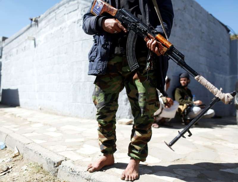 Houthi militant secures the vicinity of United Nations offices where people demonstrated to demand for reopening of Sanaa airport in Sanaa, Yemen
