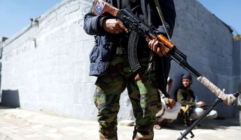 Houthi militant secures the vicinity of United Nations offices where people demonstrated to demand for reopening of Sanaa airport in Sanaa, Yemen