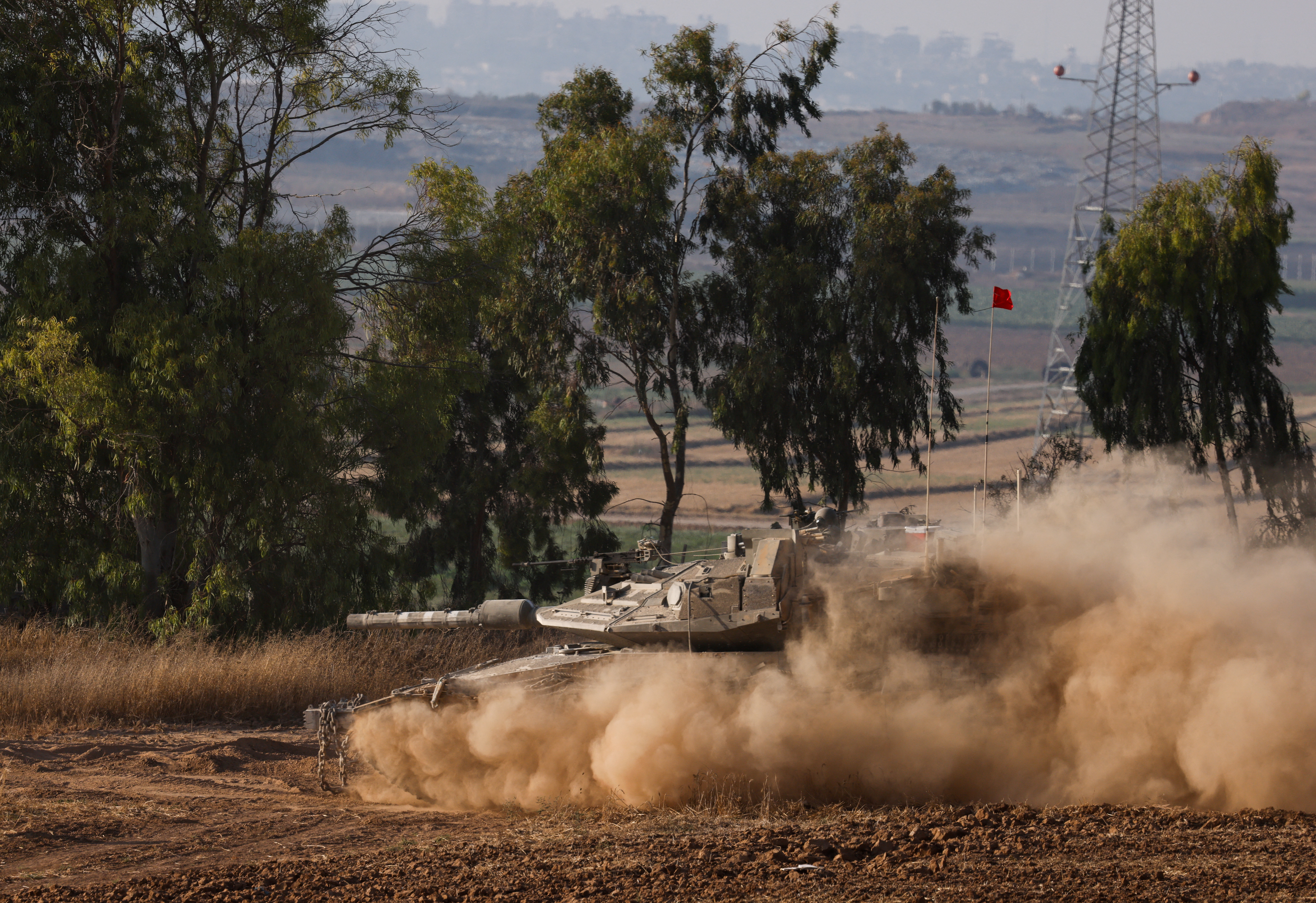An Israeli tank manoeuvres near the Israel-Gaza border