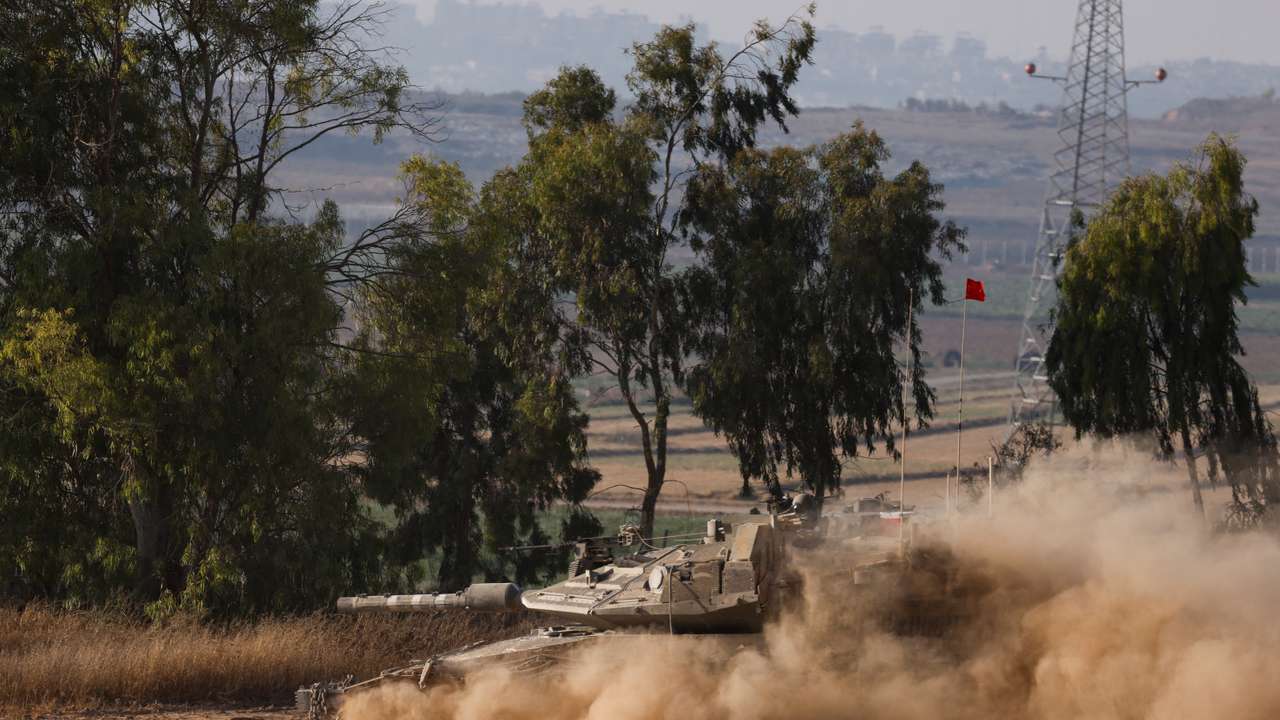 An Israeli tank manoeuvres near the Israel-Gaza border