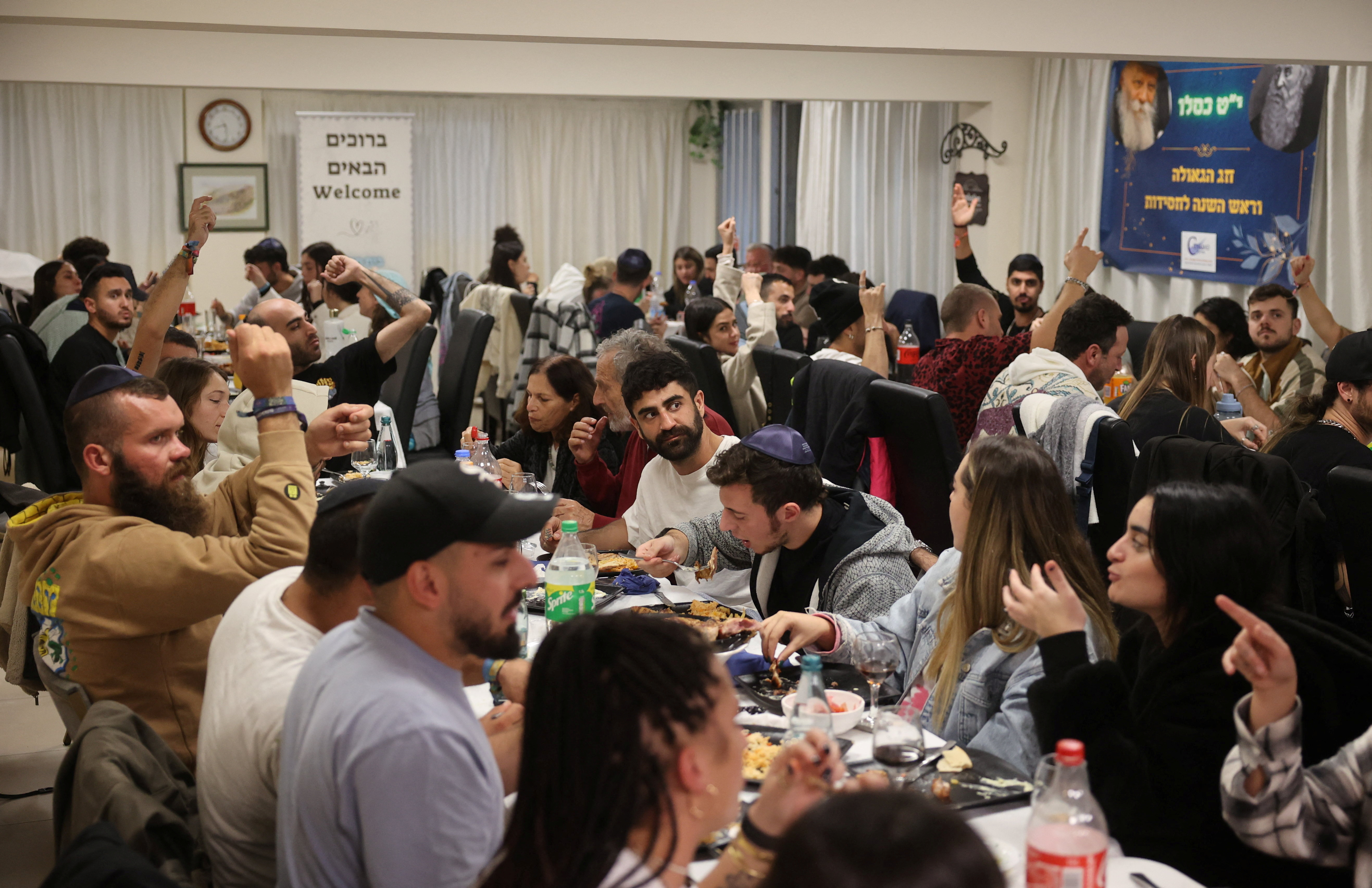 Survivors of the Hamas gunmen attack on a music festival in Israel, take part in a ceremony at the Jewish Community Centre in Larnaca