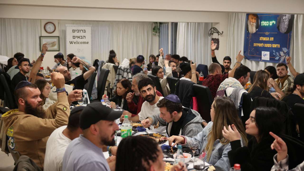 Survivors of the Hamas gunmen attack on a music festival in Israel, take part in a ceremony at the Jewish Community Centre in Larnaca