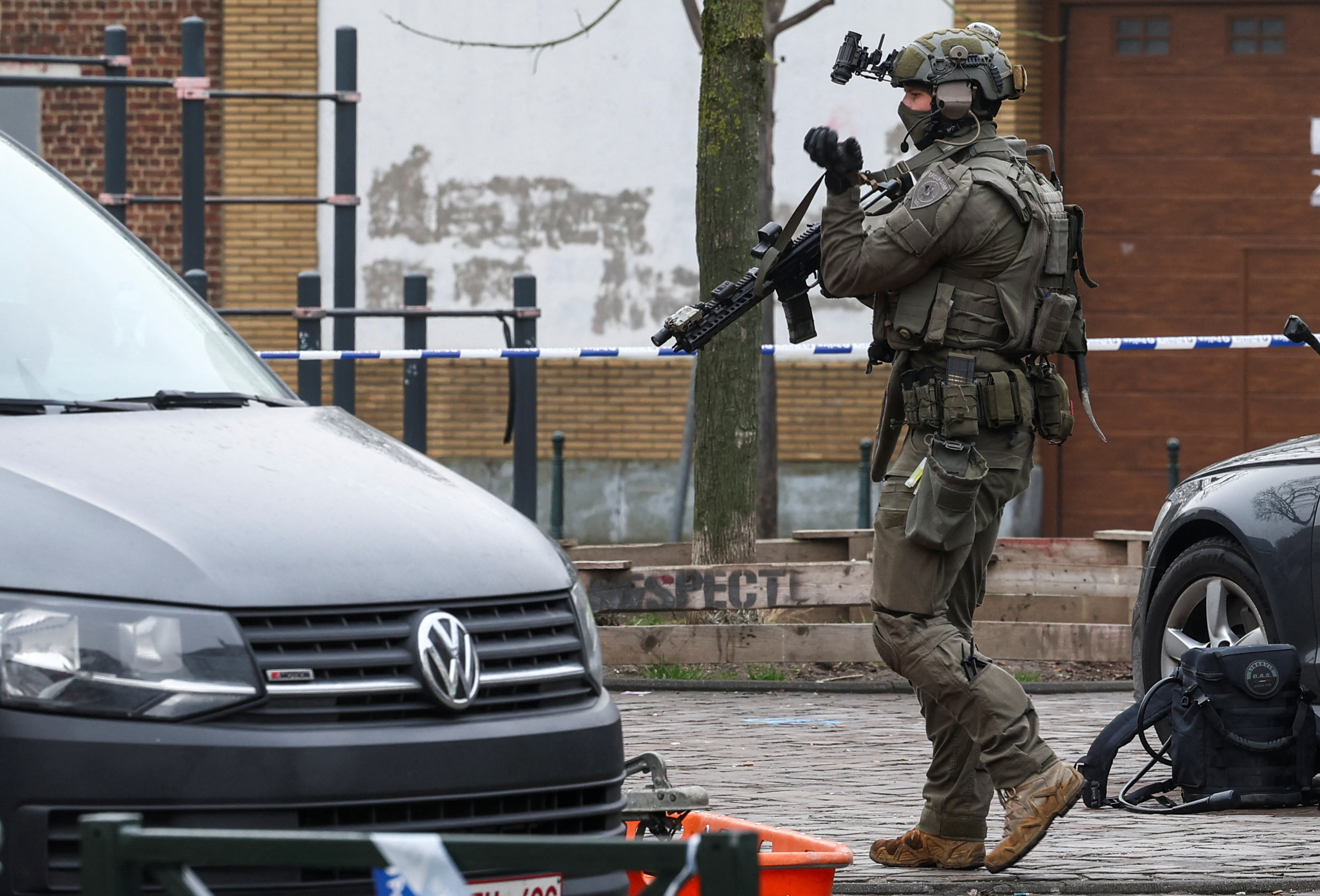 A police member works at the Clemenceau metro station, after a shooting took place in Brussels