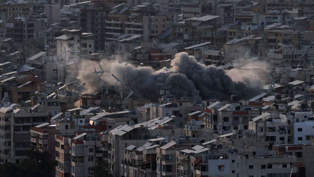 Smoke billows over Beirut's southern suburbs following Israeli strike after issuing an evacuation warning for the area, as seen from Baabda