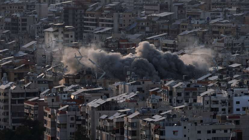 Smoke billows over Beirut's southern suburbs following Israeli strike after issuing an evacuation warning for the area, as seen from Baabda