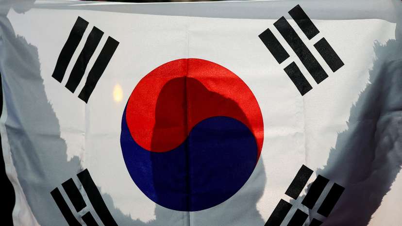 Demonstrators take part in a protest in front of the National Assembly in Seoul