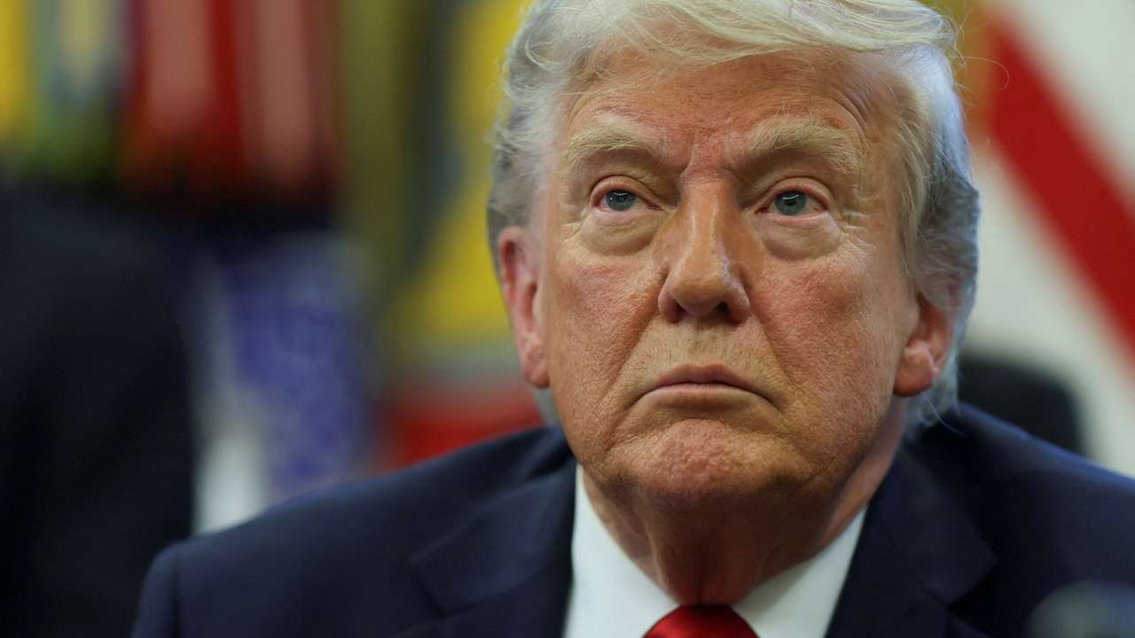 FILE PHOTO: U.S. President Donald Trump looks on, as he signs executive orders in the Oval Office at the White House in Washington, D.C., U.S., April 23, 2025. REUTERS/Leah Millis/File Photo