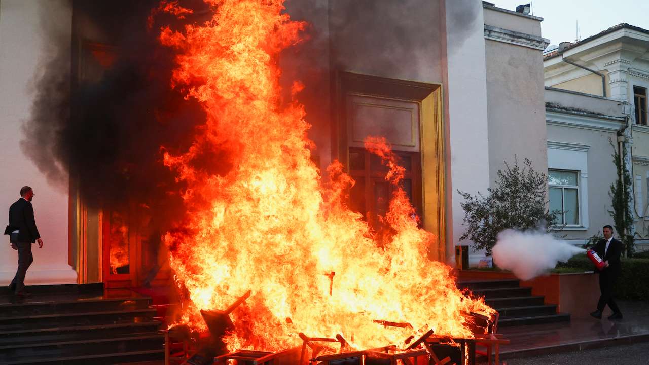 Members of the opposition burn their chairs outside the parliament building, to protest against the government and the imprisonment of their colleague Ervin Salianji, in Tirana