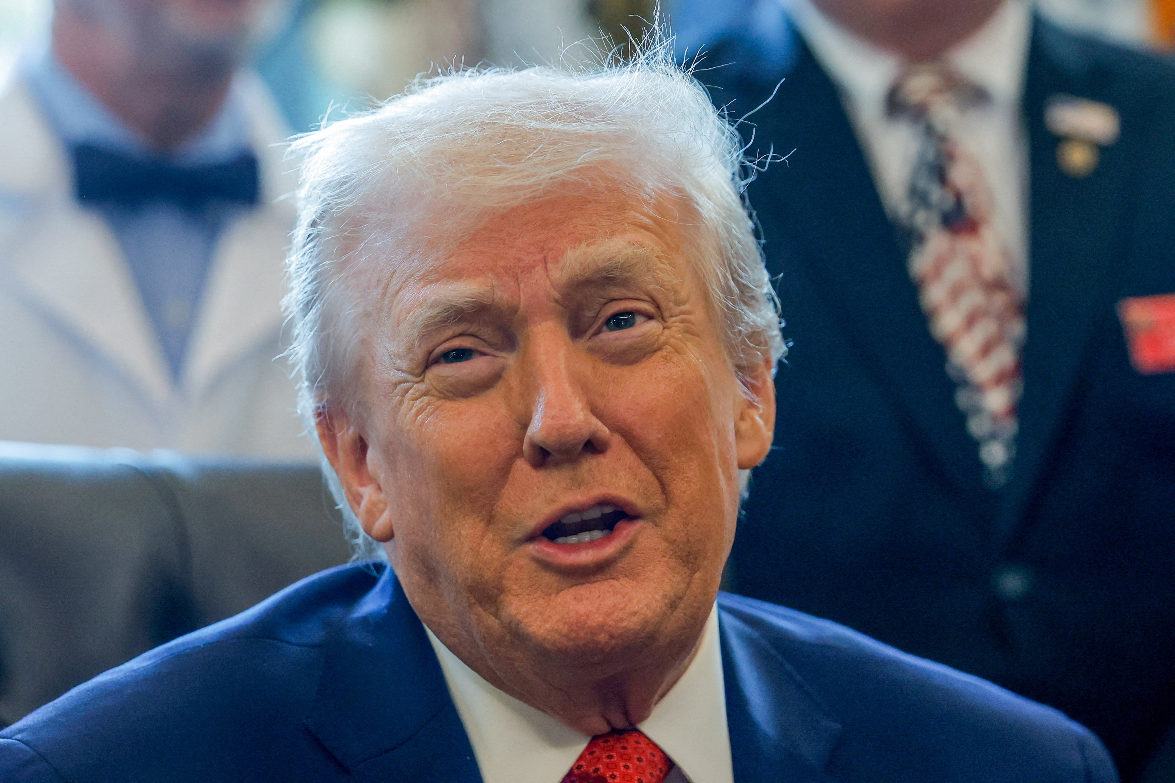 U.S. President Trump signs executive orders at the Oval Office, in Washington