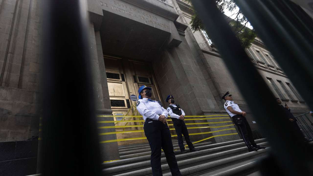 Law enforcement officers guard the main entrance of the Supreme Court of Justice (SCJN) after judges decided to join the work stoppage due to a debate in Congress on a controversial judicial reform in Mexico City