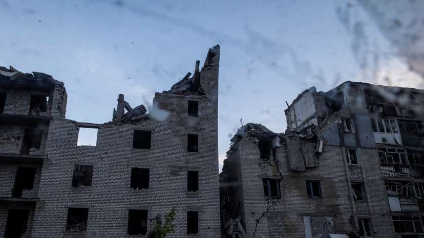 A view shows heavily damaged residential buildings in the town of Chasiv Yar