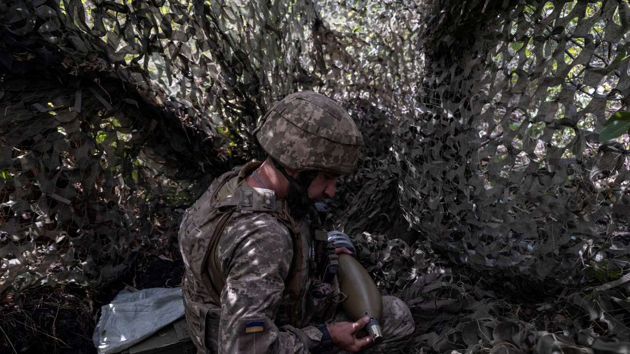 FILE PHOTO: Ukrainian service member prepares mortar shells before firing toward Russian troops near the frontline town of Kostiantynivka
