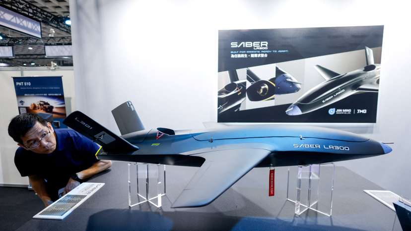 A visitor looks at a model of the Saber LR300 unmanned aerial vehicle, developed by Taiwan’s Jiin Ming Industry, in Taipei