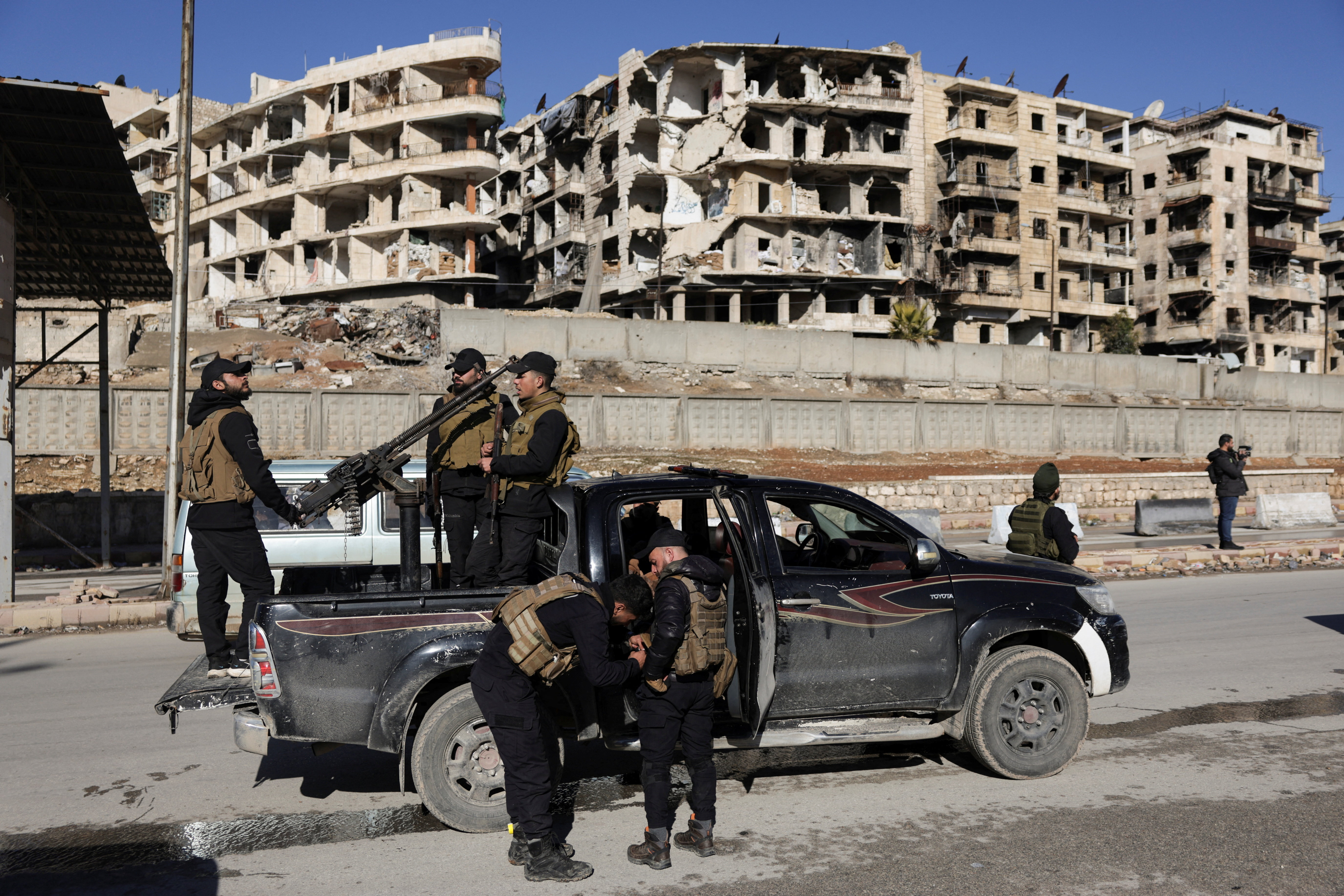 Members of the general security forces at the Sheikh Maksoud neighbourhood after taking control of the area, in Aleppo