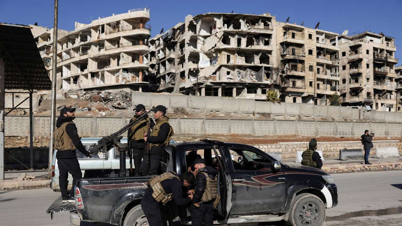 Members of the general security forces at the Sheikh Maksoud neighbourhood after taking control of the area, in Aleppo