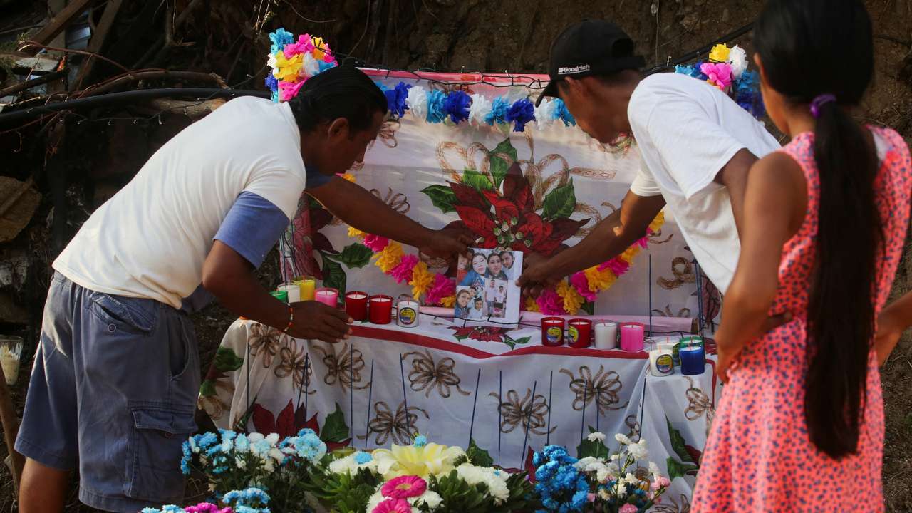 Candido Trinidad de la Cruz, who lost his family and home during Hurricane Otis, places an altar in their memory, in Acapulco