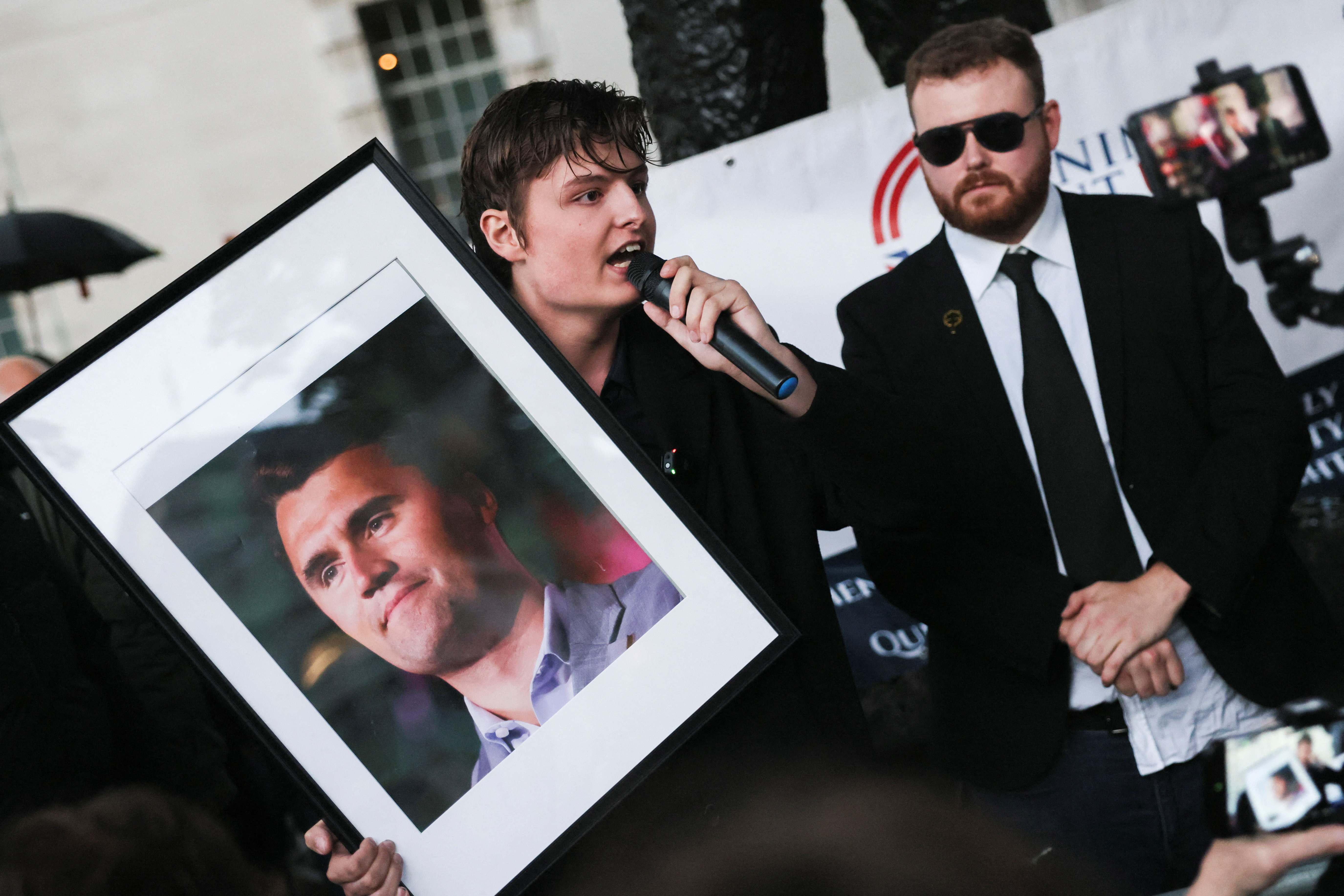 People attend a vigil at the Montgomery Statue in London