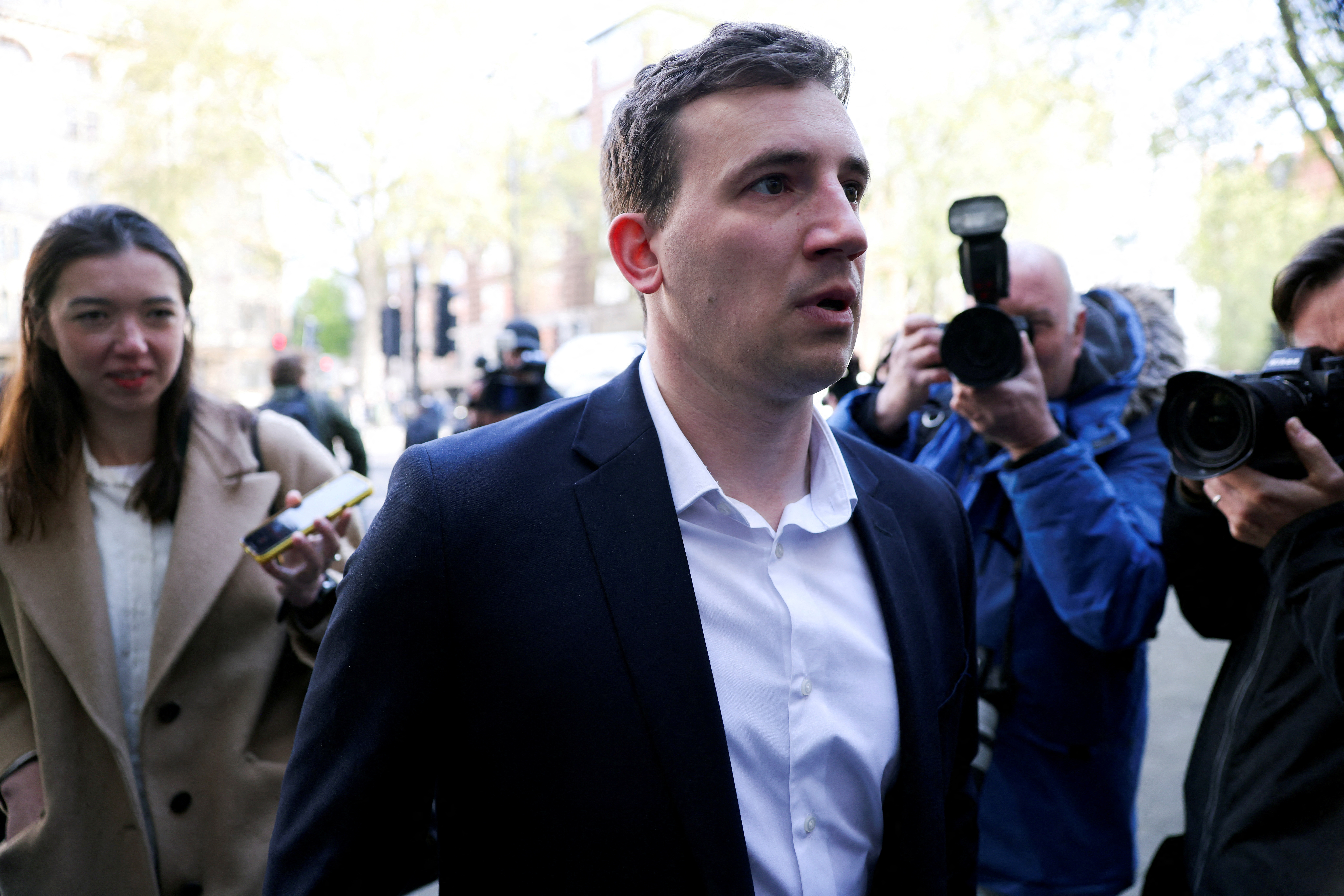 Christopher Cash, 29, who has been charged with spying for China, arrives at Westminster Magistrates' Court in London