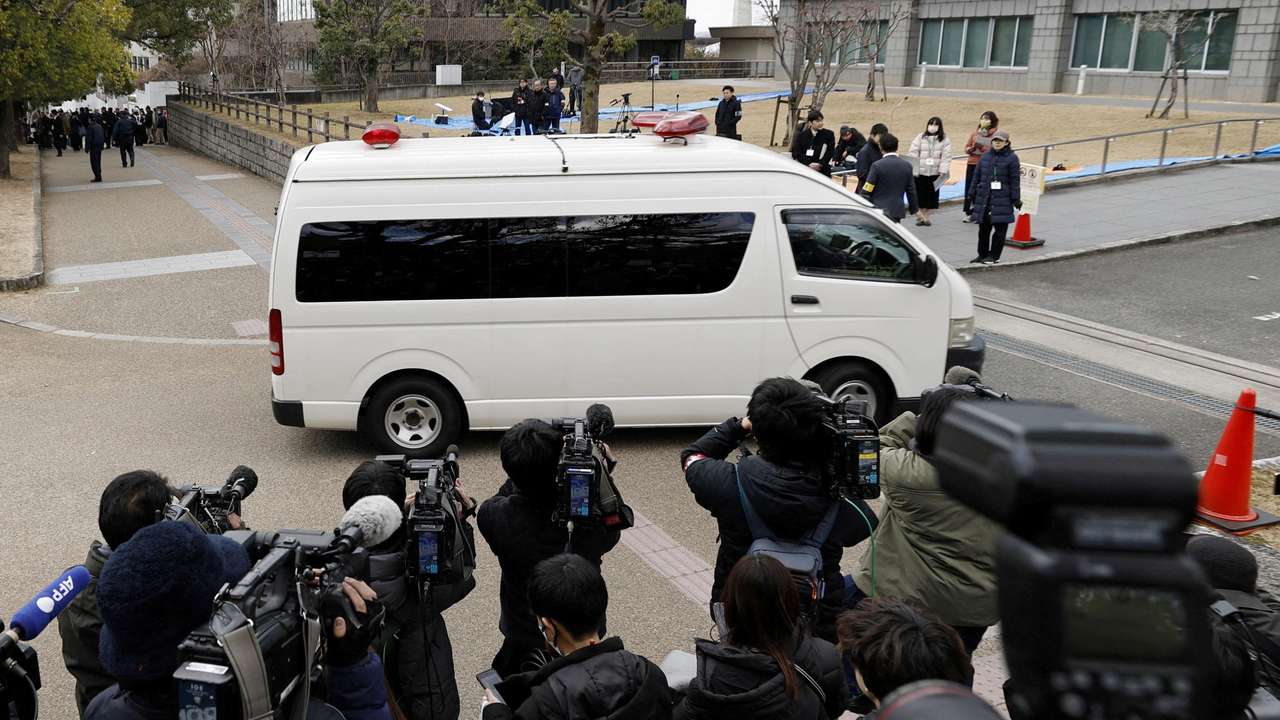 A vehicle carrying Tetsuya Yamagami, who is accused of fatally shooting former Prime Minister Shinzo Abe, enters the Nara District Court in Nara