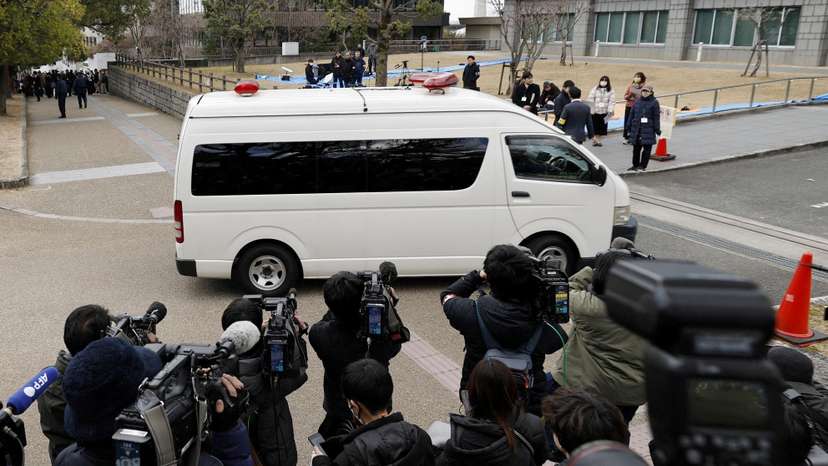 A vehicle carrying Tetsuya Yamagami, who is accused of fatally shooting former Prime Minister Shinzo Abe, enters the Nara District Court in Nara
