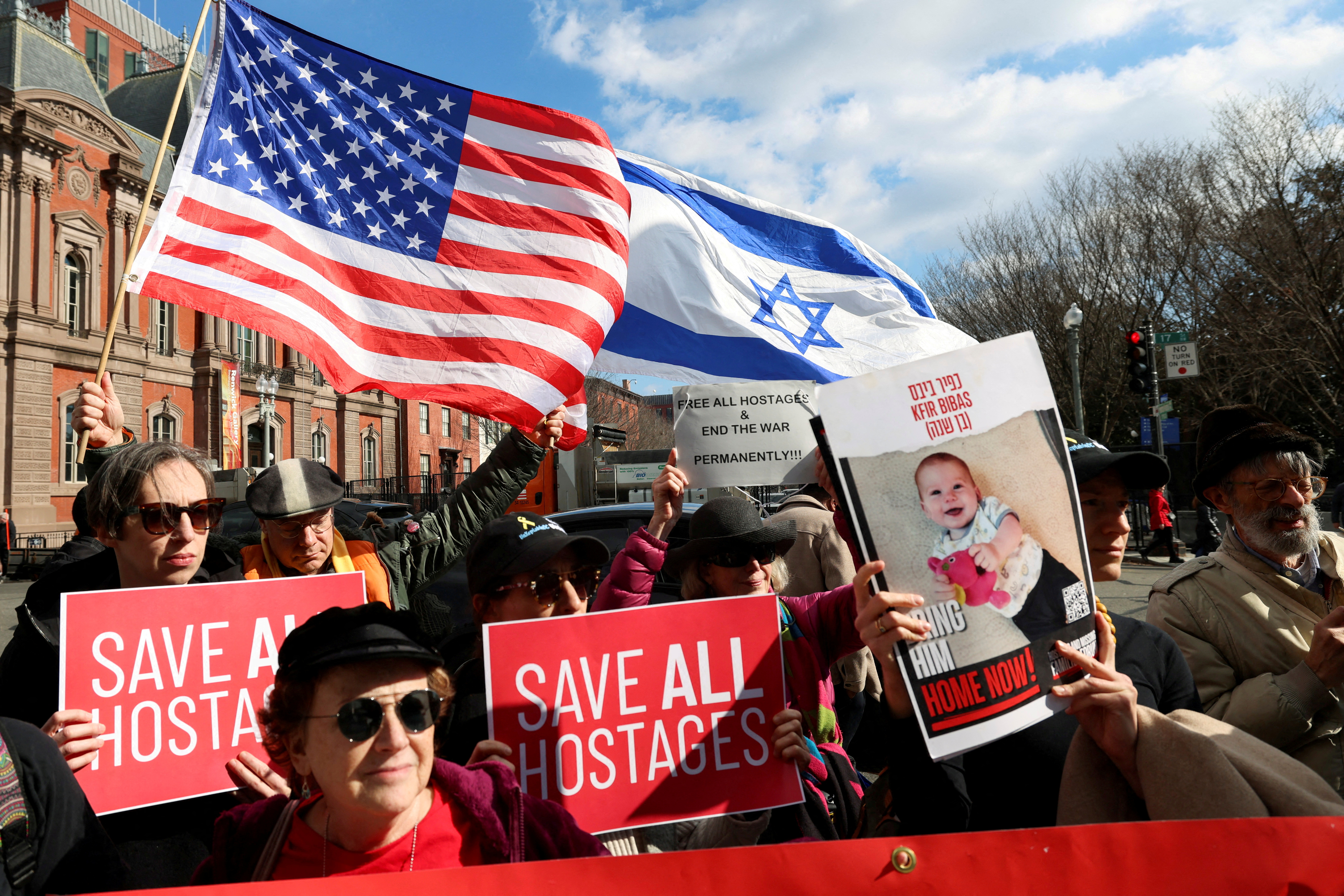 FILE PHOTO: People demonstrate as U.S. President Trump meets Israeli PM Netanyahu in Washington