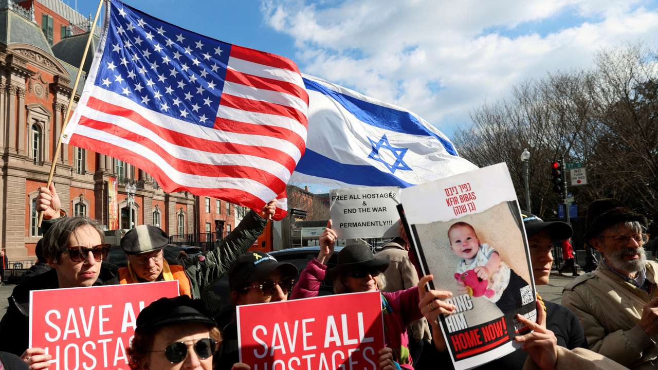 FILE PHOTO: People demonstrate as U.S. President Trump meets Israeli PM Netanyahu in Washington