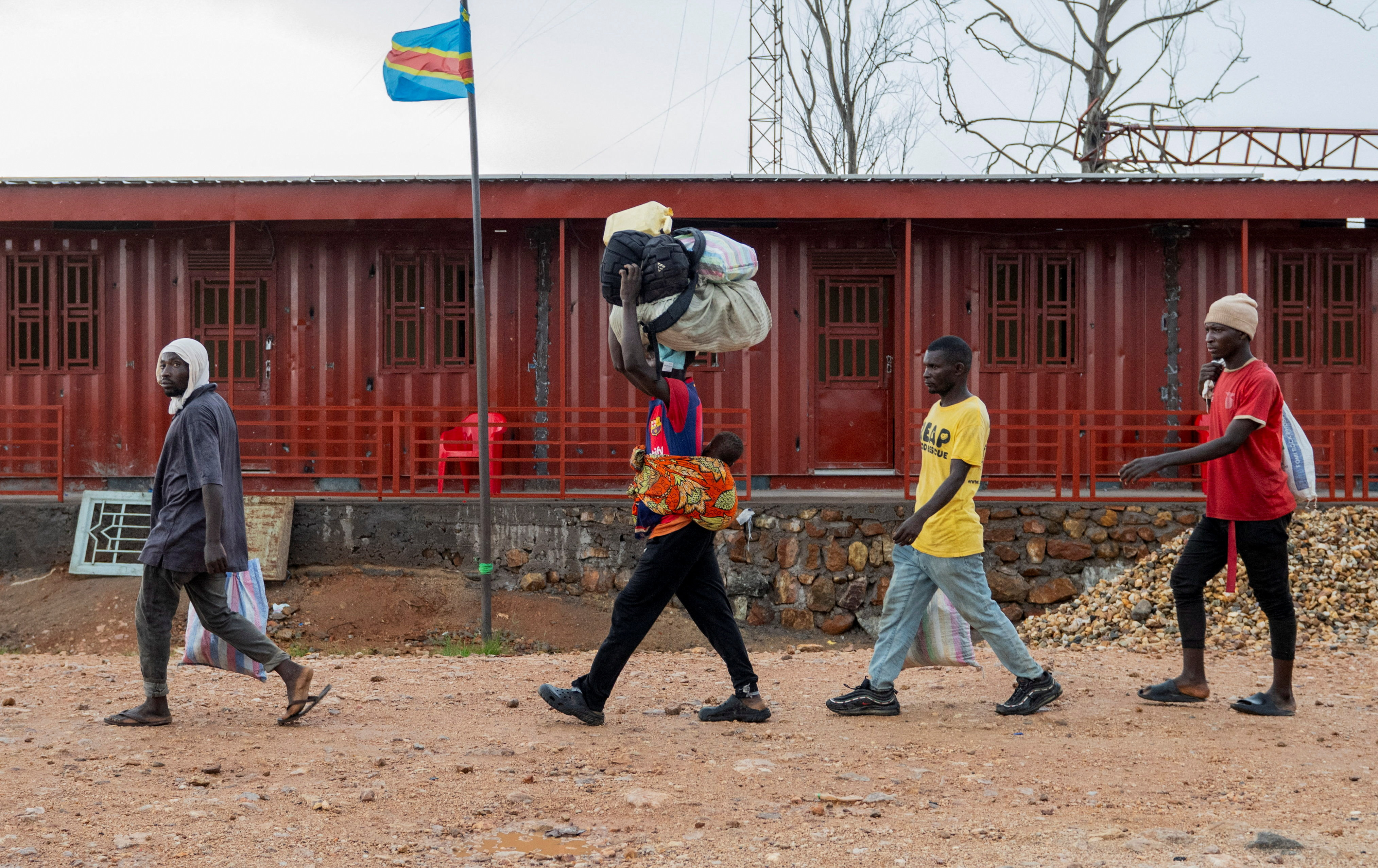 Foreigners who had been stranded during clashes between members of the AFC-M23 Movement who took over Uvira town and FARDC prepare to cross the border to Burundi