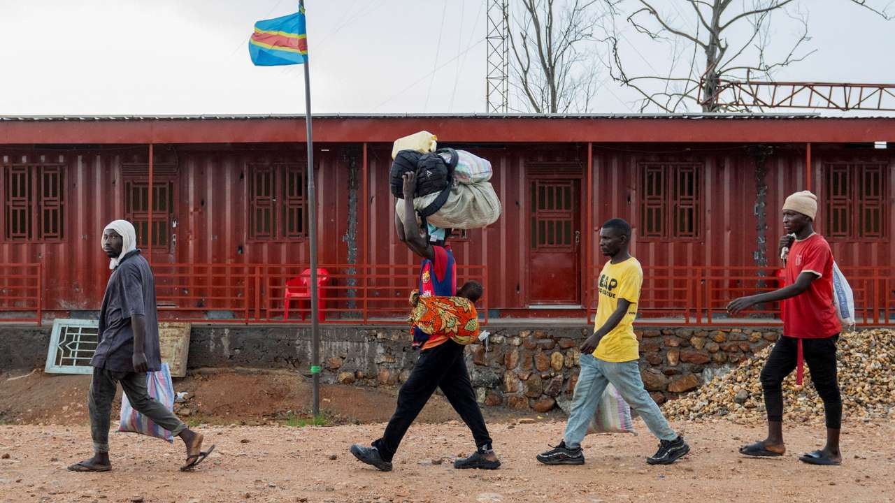 Foreigners who had been stranded during clashes between members of the AFC-M23 Movement who took over Uvira town and FARDC prepare to cross the border to Burundi