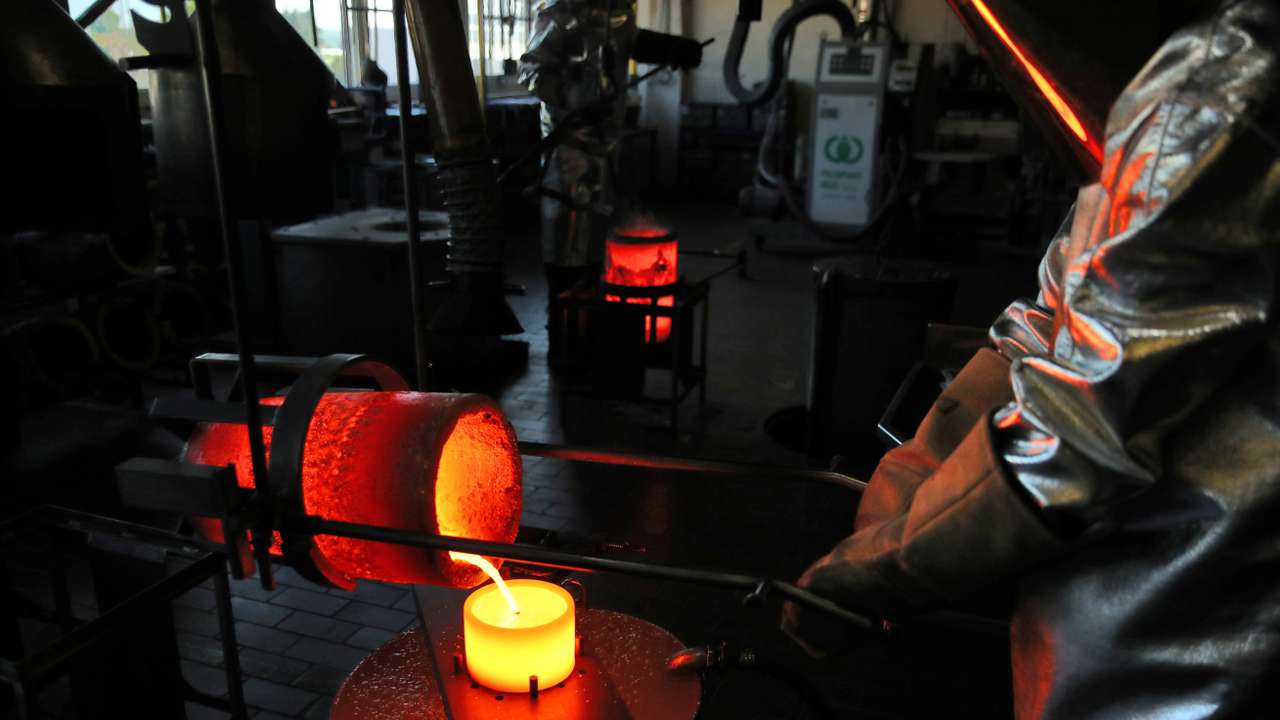 Liquid gold is poured to form grains at Swiss refinery Metalor in Marin