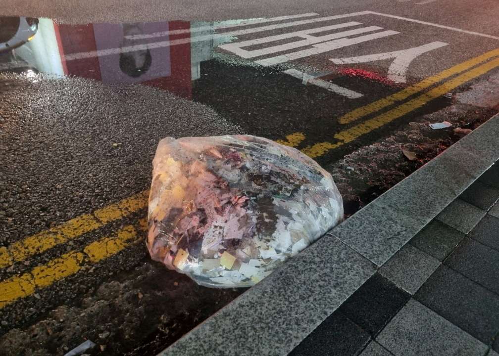 FILE PHOTO: FILE PHOTO: A plastic bag carrying various objects including what appeared to be trash that crossed inter-Korean border with a balloon believed to have been sent by North Korea, is pictured in Seoul