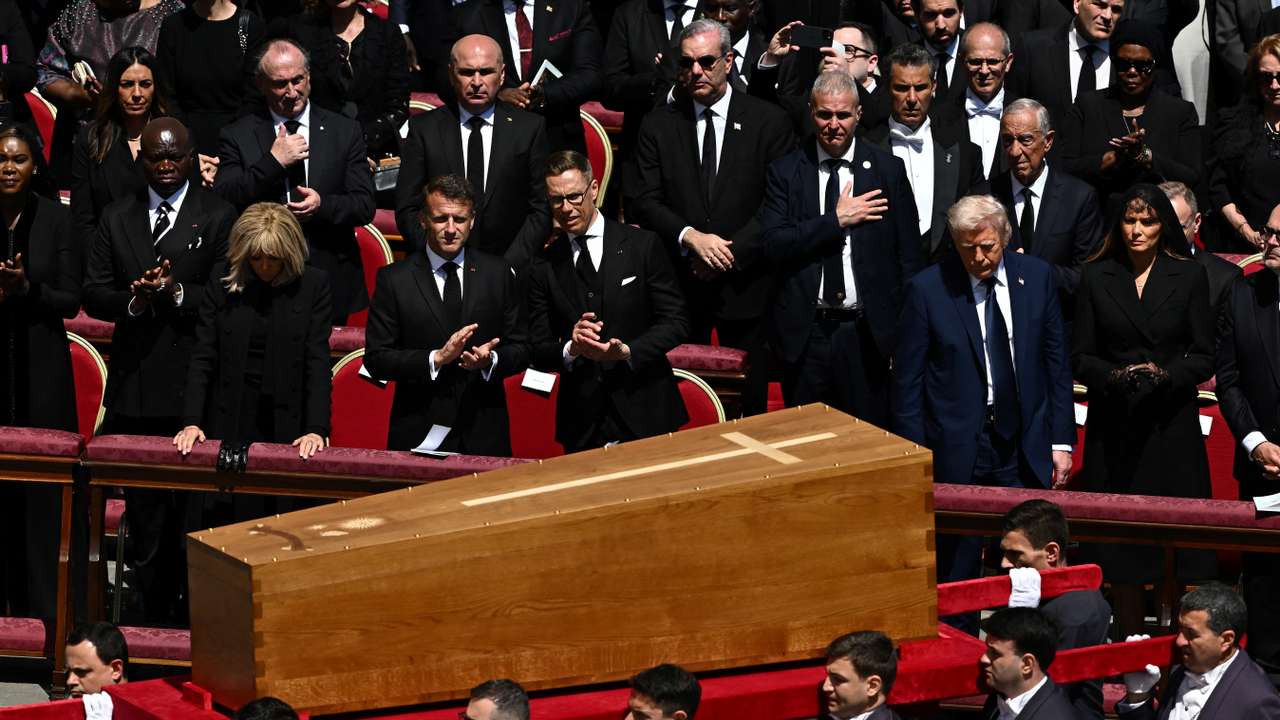 U.S. President Donald Trump, first lady Melania Trump, France's President Emmanuel Macron and his wife Brigitte Macron watch as the coffin of Pope Francis is carried by pallbearers during his funeral Mass in St. Peter's Square at the Vatican, April 26, 2025. REUTERS/Dylan Martinez