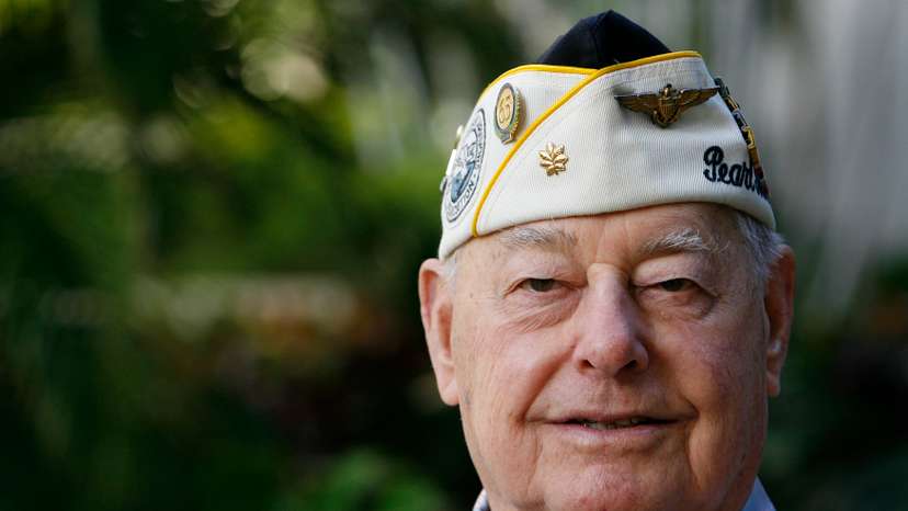 Pearl Harbor survivor Louis Conter poses for the camera at the Hale Koa hotel in Honolulu