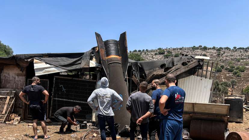 People look at an apparent remains of a ballistic missile following missile attack by Iran on Israel earlier today, in northern Israel