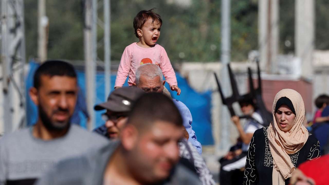 Palestinians flee north Gaza towards the south, amid the ongoing conflict between Israel and Palestinian Islamist group Hamas, in the central Gaza Strip