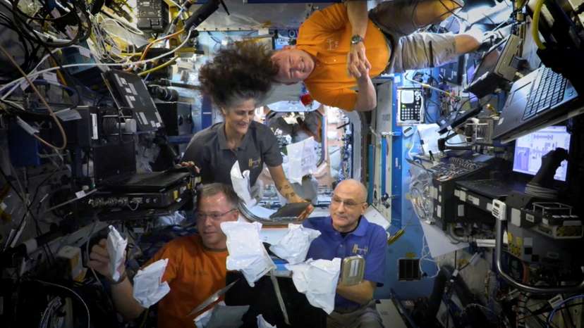 FILE PHOTO: NASA astronauts on ISS unbox Thanksgiving meals in space