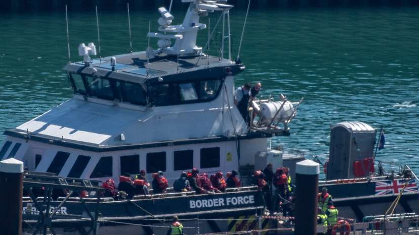 FILE PHOTO: Migrants arrive in the UK after crossing the English Channel